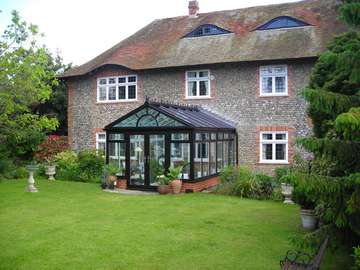 Mold North Wales. Design and build conservatory. Allstyle Ornate windows and doors . Ultraframe Aluminium roof glazed with Pilkington Activ Blue double glazed units 